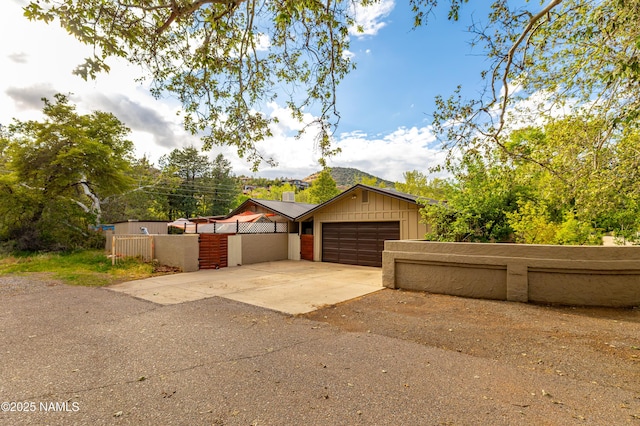 1125 Trails End Dr, Sedona, AZ 86336 - view of front facade with an attached garage and driveway