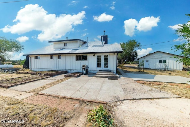 back of house with a patio area