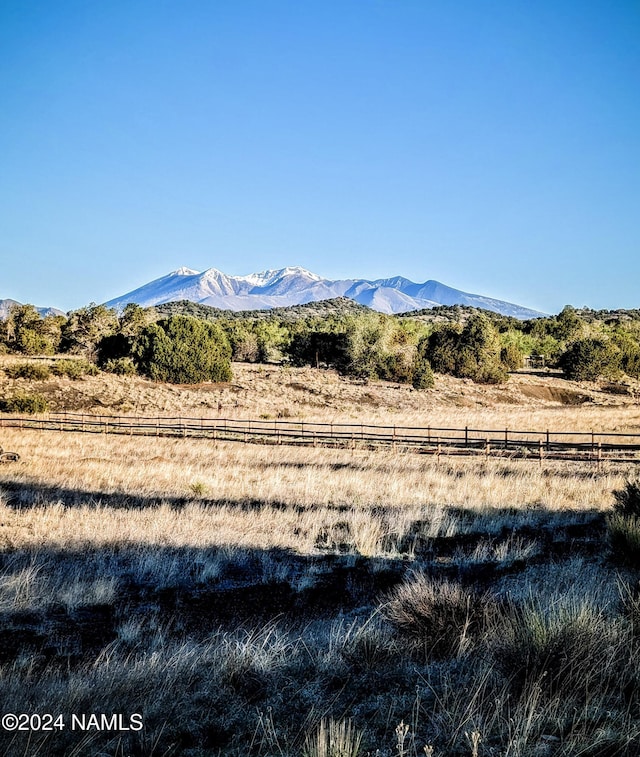 view of mountain feature with a rural view