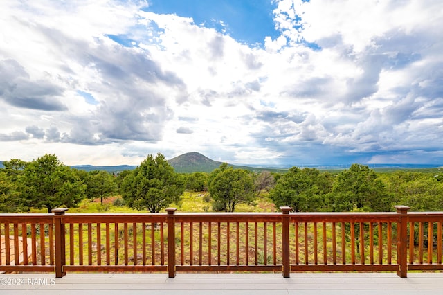 wooden deck featuring a mountain view