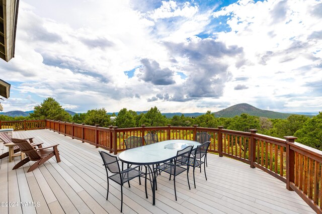 wooden terrace featuring a mountain view