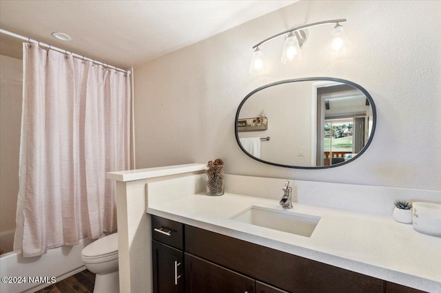 full bathroom with vanity, wood-type flooring, shower / bath combination with curtain, and toilet