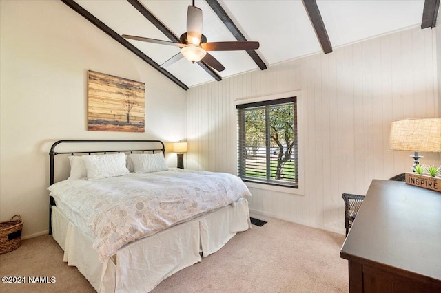 bedroom featuring lofted ceiling with beams, light carpet, and ceiling fan