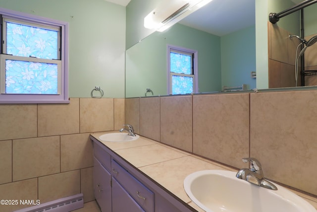 bathroom featuring vanity, tile walls, and baseboard heating