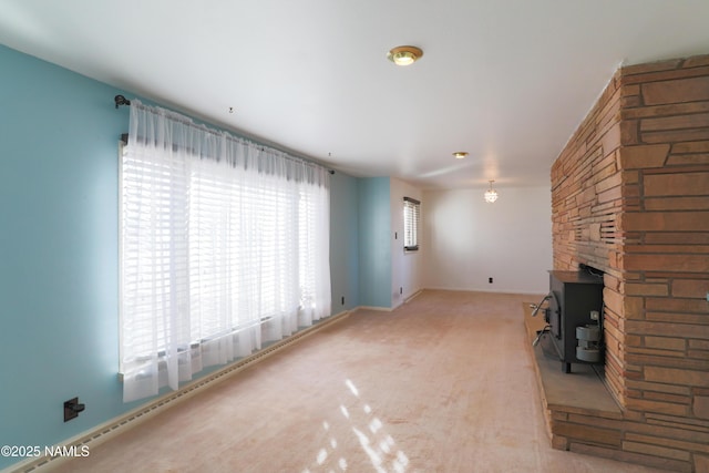 unfurnished living room with light colored carpet