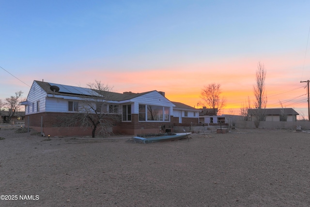 view of front of property with solar panels