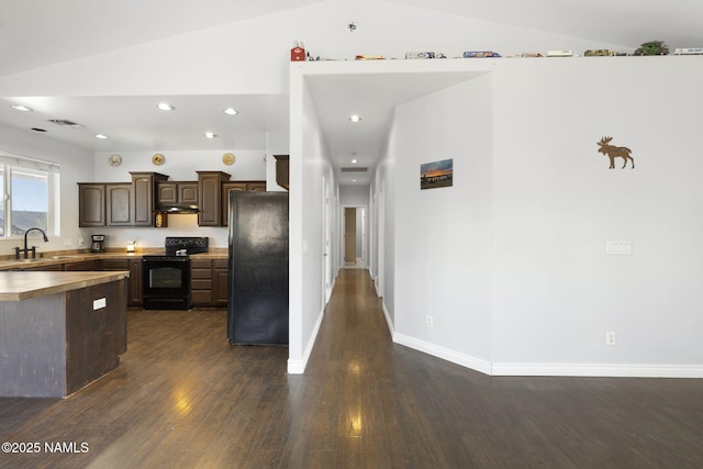 905 Hereford Dr, Williams, AZ 86046 - kitchen featuring black appliances, vaulted ceiling, a sink, dark brown cabinets, and dark wood-style flooring