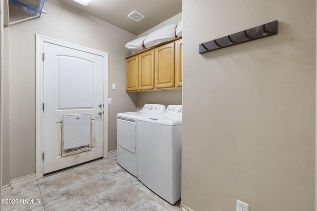 905 Hereford Dr, Williams, AZ 86046 - laundry area featuring washer and clothes dryer, cabinet space, baseboards, and light tile patterned flooring