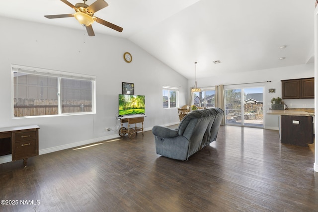 905 Hereford Dr, Williams, AZ 86046 - living area with ceiling fan, dark wood-style floors, baseboards, and high vaulted ceiling