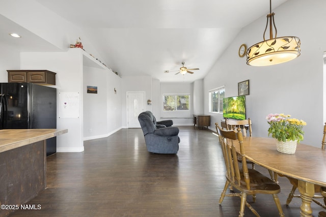905 Hereford Dr, Williams, AZ 86046 - dining space with vaulted ceiling, a ceiling fan, dark wood-type flooring, and baseboards