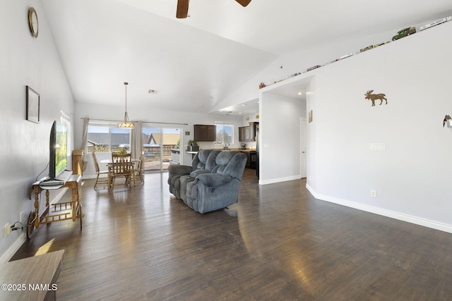 905 Hereford Dr, Williams, AZ 86046 - living area featuring ceiling fan, baseboards, dark wood finished floors, and high vaulted ceiling