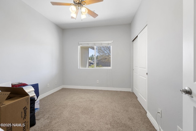 905 Hereford Dr, Williams, AZ 86046 - unfurnished bedroom with carpet flooring, baseboards, a closet, and a ceiling fan