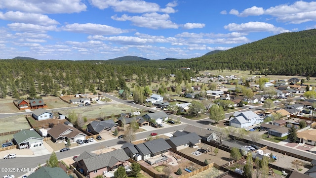 905 Hereford Dr, Williams, AZ 86046 - aerial view of property's location with a forest, nearby suburban area, and mountains