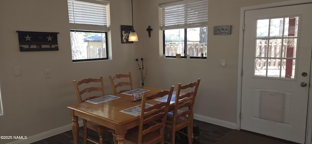 1111 W Sheridan Ave, Williams, AZ 86046 - dining room with baseboards, healthy amount of natural light, and dark wood-style flooring