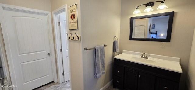 1111 W Sheridan Ave, Williams, AZ 86046 - bathroom with vanity and baseboards