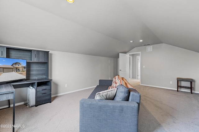 sitting room featuring vaulted ceiling and carpet