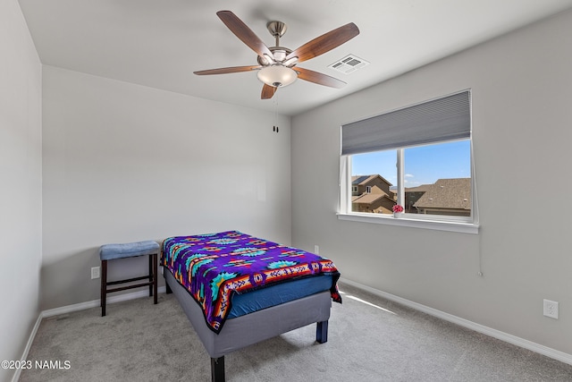 bedroom with light carpet and ceiling fan