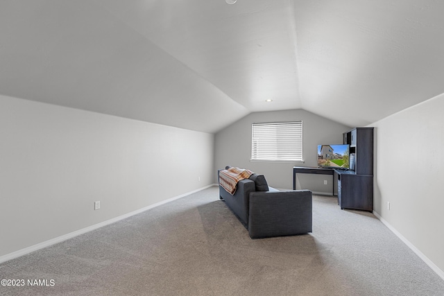 interior space with carpet and lofted ceiling