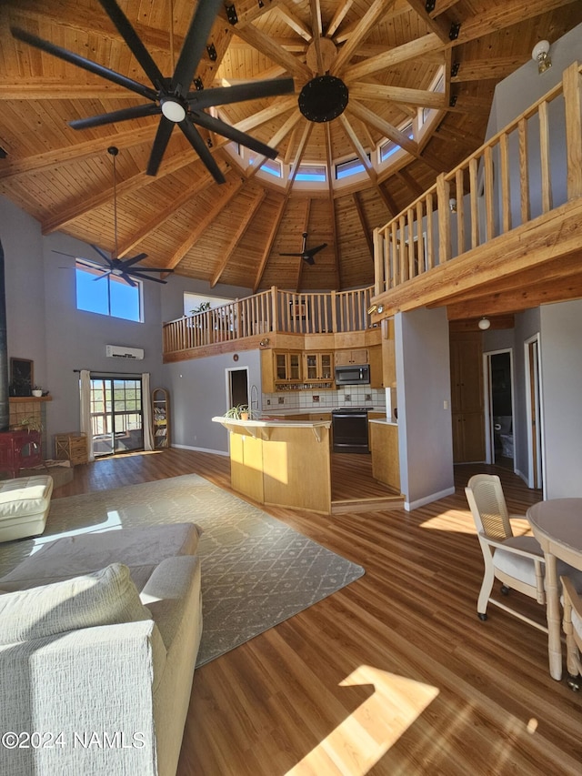 unfurnished living room with light wood-type flooring, ceiling fan, high vaulted ceiling, and wood ceiling