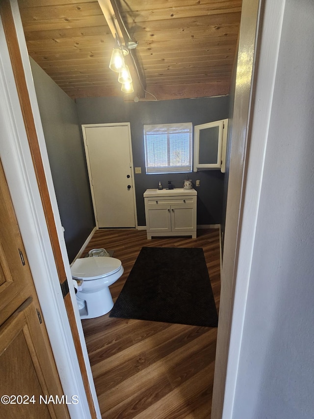 bathroom featuring wood ceiling, toilet, hardwood / wood-style floors, and lofted ceiling