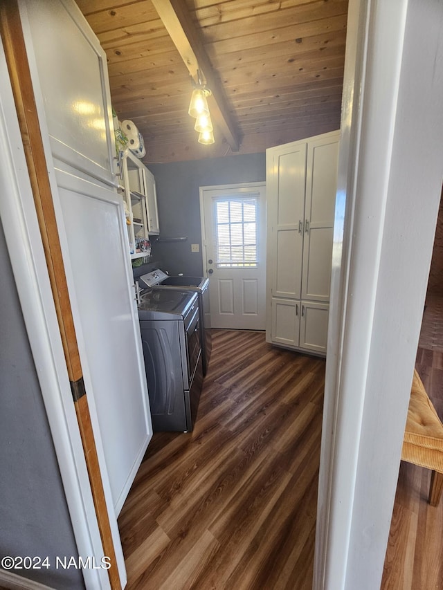 laundry area with wood ceiling, cabinets, dark hardwood / wood-style floors, and washing machine and dryer