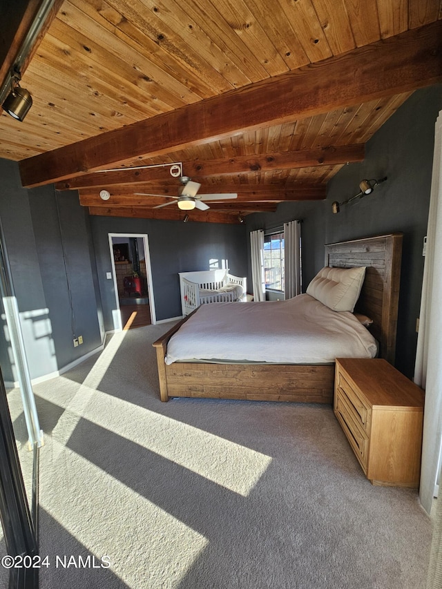 bedroom featuring wooden ceiling, carpet flooring, and beam ceiling