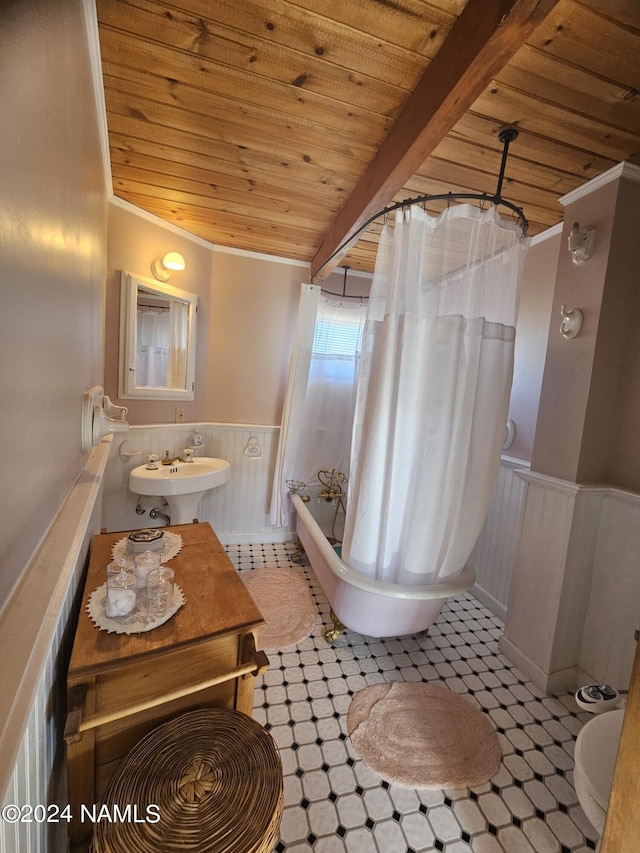 bathroom featuring sink, beamed ceiling, shower / bath combination with curtain, and wooden ceiling