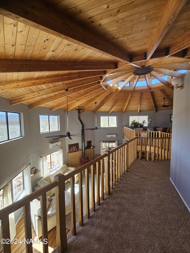 interior space with carpet floors, high vaulted ceiling, beam ceiling, and wood ceiling