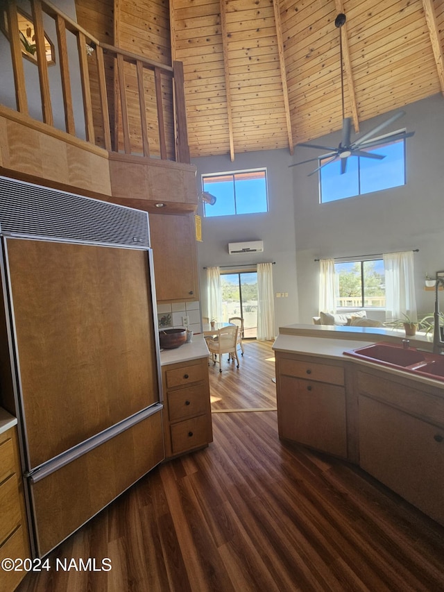 kitchen with wooden ceiling, high vaulted ceiling, beam ceiling, ceiling fan, and dark hardwood / wood-style floors