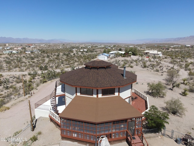 birds eye view of property featuring a mountain view