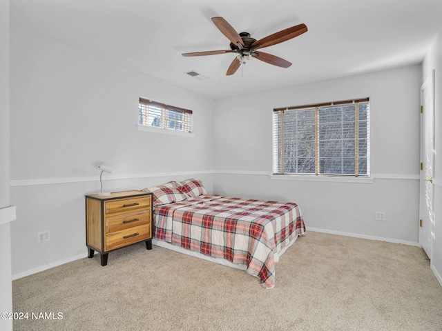 carpeted bedroom with ceiling fan