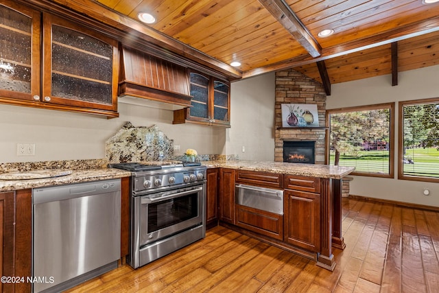 kitchen featuring kitchen peninsula, custom range hood, light stone countertops, wooden ceiling, and stainless steel appliances