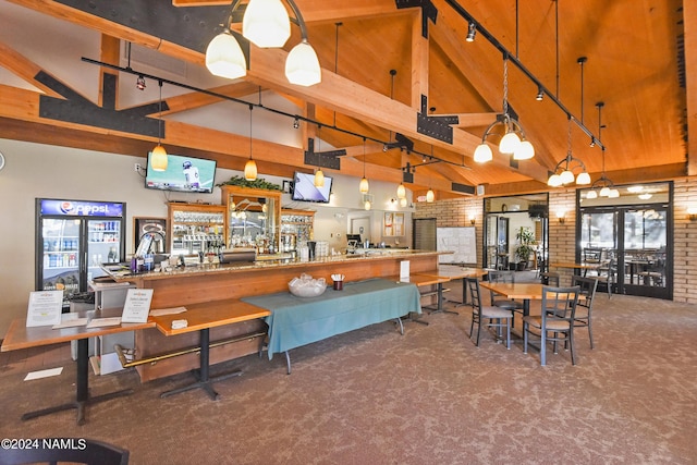 dining room featuring high vaulted ceiling, beam ceiling, and carpet