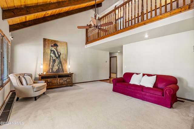 carpeted living room with high vaulted ceiling, ceiling fan, wood ceiling, and beamed ceiling