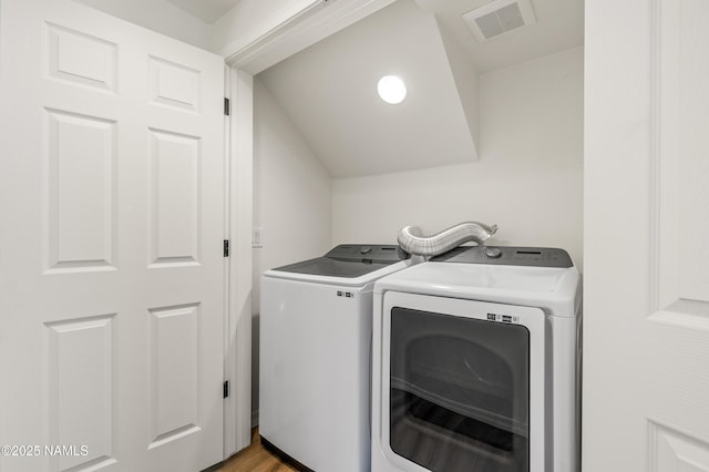 5026 E Retreat Cir, Flagstaff, AZ 86004 - laundry room with washer and dryer and light wood-type flooring