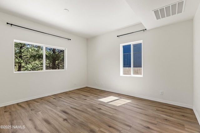 5026 E Retreat Cir, Flagstaff, AZ 86004 - spare room featuring wood finished floors and baseboards
