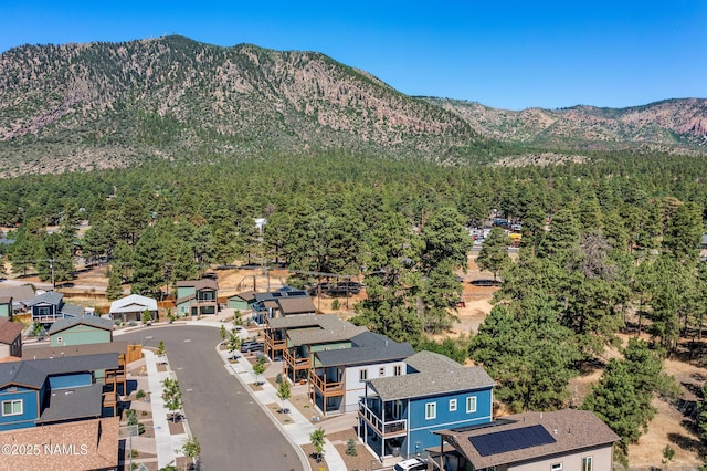 5026 E Retreat Cir, Flagstaff, AZ 86004 - mountain view featuring a heavily wooded area and nearby suburban area