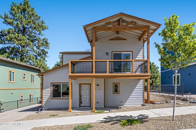 5026 E Retreat Cir, Flagstaff, AZ 86004 - view of front of house with a balcony and covered porch