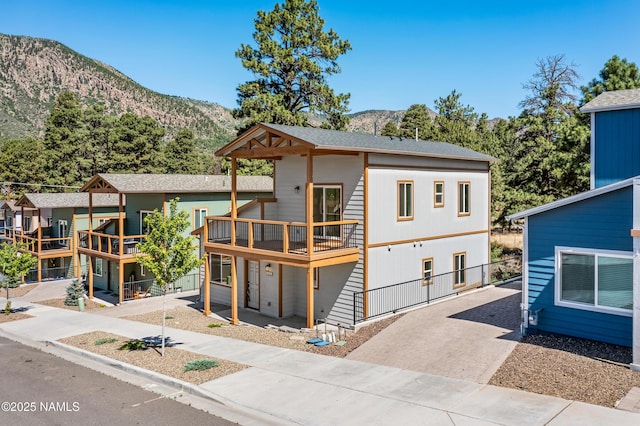 5026 E Retreat Cir, Flagstaff, AZ 86004 - view of front of property with a mountain view and driveway