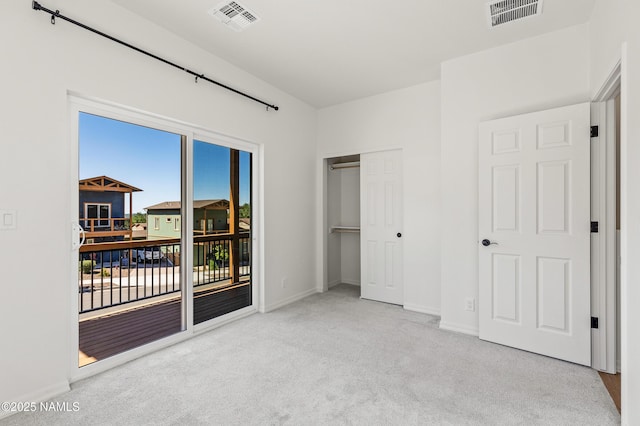 5026 E Retreat Cir, Flagstaff, AZ 86004 - unfurnished bedroom featuring access to exterior, carpet floors, and a closet