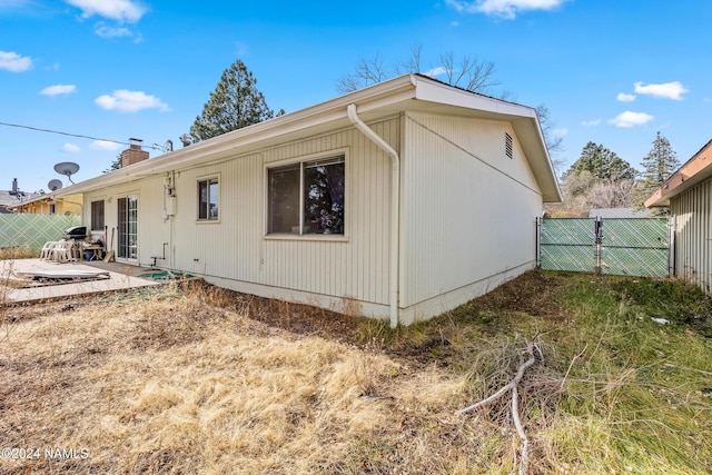 rear view of property featuring a patio area