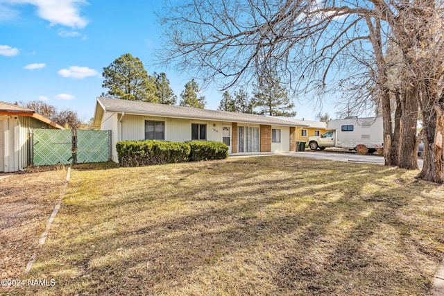 ranch-style house with a front yard