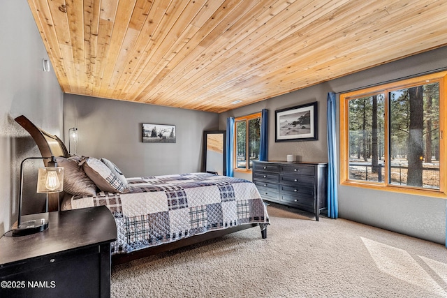 carpeted bedroom featuring wood ceiling