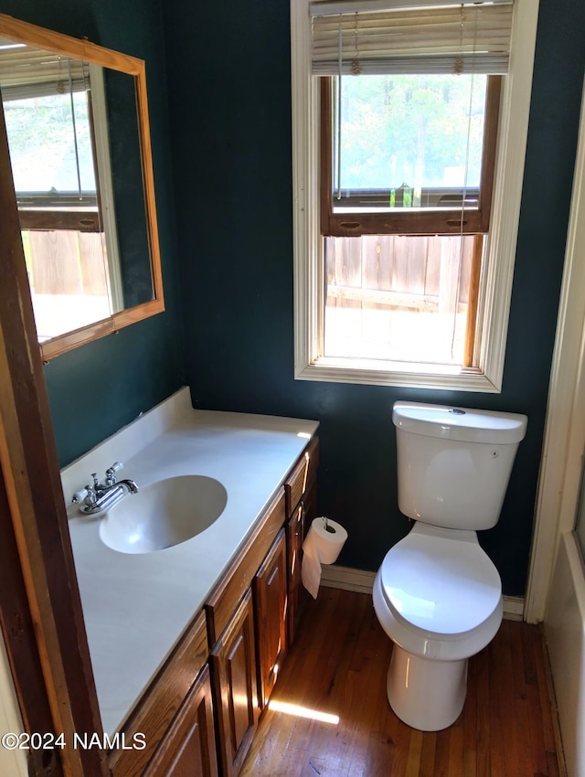 1600 S River Valley Rd, Flagstaff, AZ 86004 - bathroom featuring toilet, vanity, wood finished floors, and baseboards