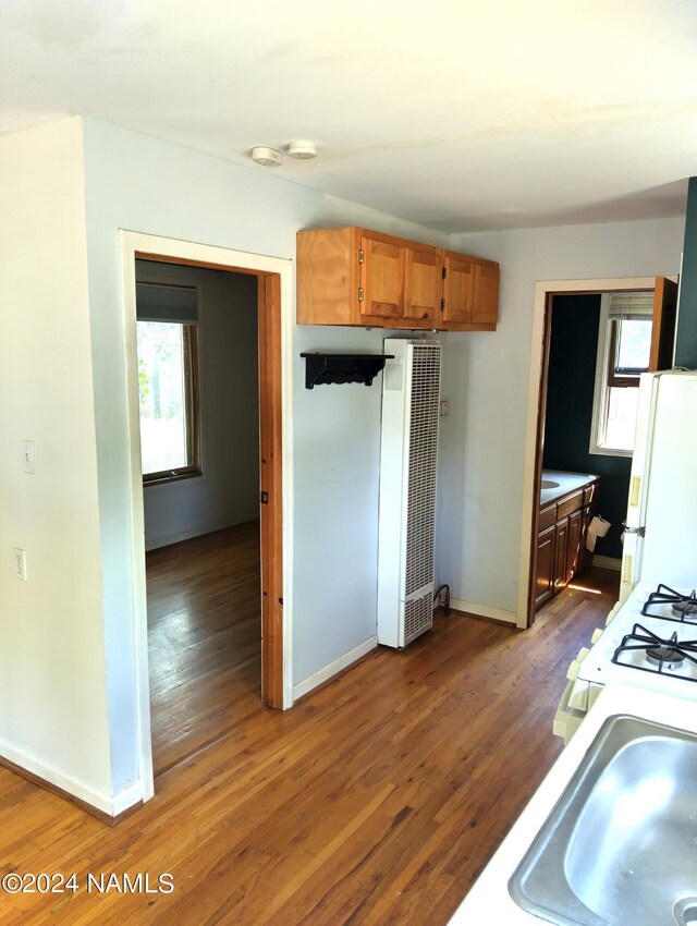 1600 S River Valley Rd, Flagstaff, AZ 86004 - kitchen featuring white appliances, baseboards, a sink, and wood finished floors