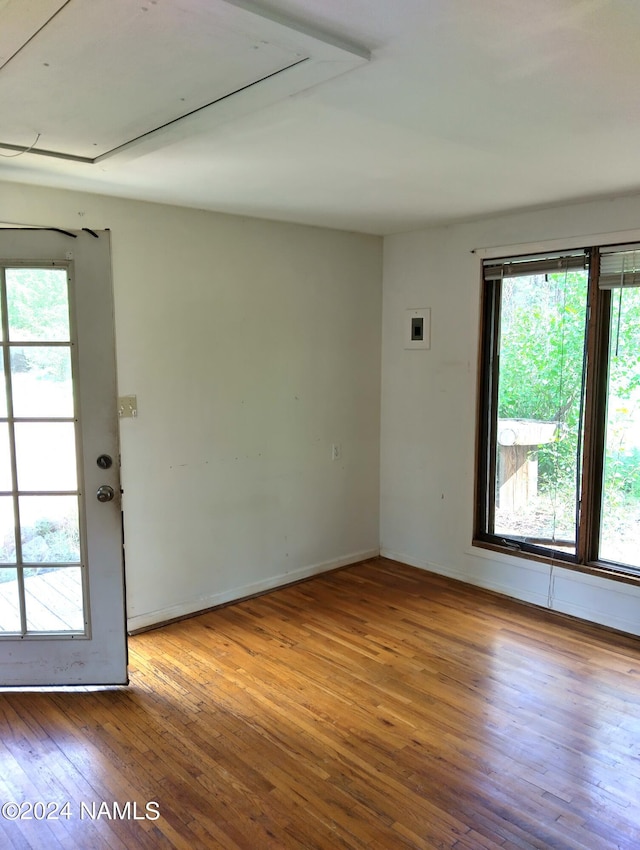 1600 S River Valley Rd, Flagstaff, AZ 86004 - spare room featuring hardwood / wood-style floors and a healthy amount of sunlight