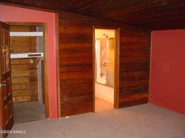 1600 S River Valley Rd, Flagstaff, AZ 86004 - unfurnished bedroom featuring ensuite bathroom, wooden ceiling, and carpet floors