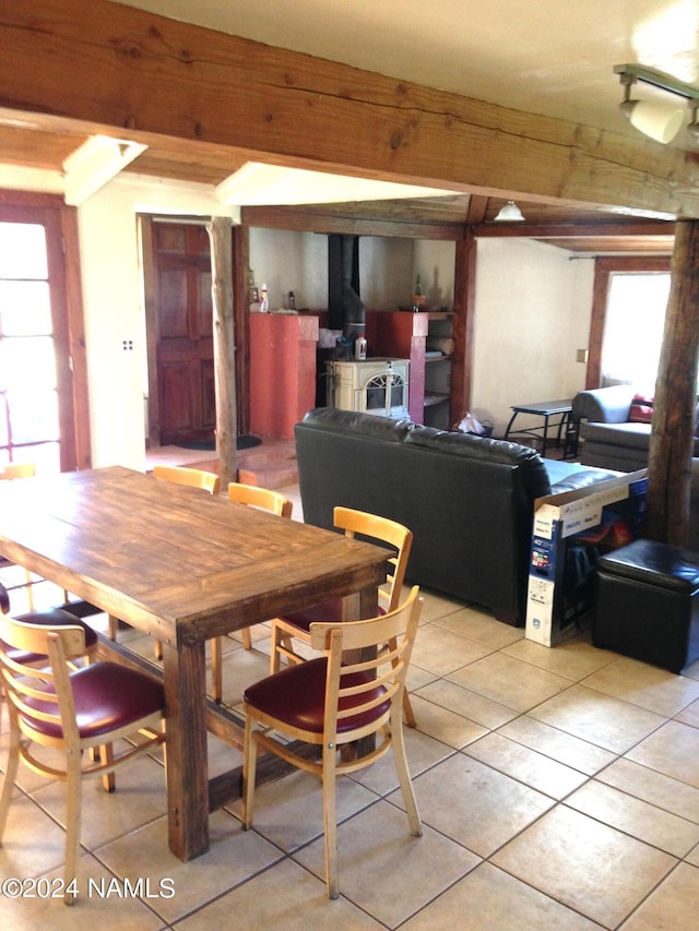 1600 S River Valley Rd, Flagstaff, AZ 86004 - dining area with light tile patterned floors and a wood stove