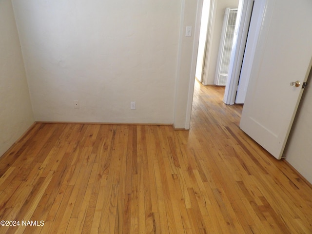 spare room with light hardwood / wood-style flooring