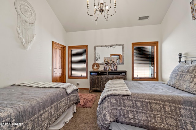 bedroom featuring an inviting chandelier, vaulted ceiling, and dark carpet